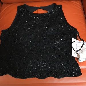 Sequined black halter top for evening occasions.